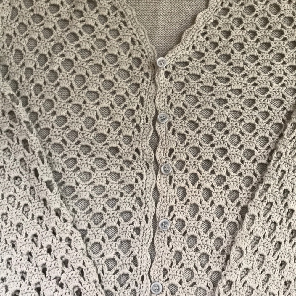 Powder blue crocheted cotton cardigan sweater.